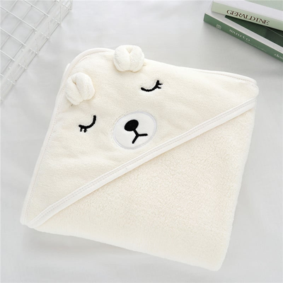 cape de bain bébé design ours blanc pliée