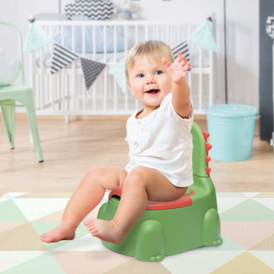 bébé assis sur pot bebe dinosaure vert dans chambre bébé